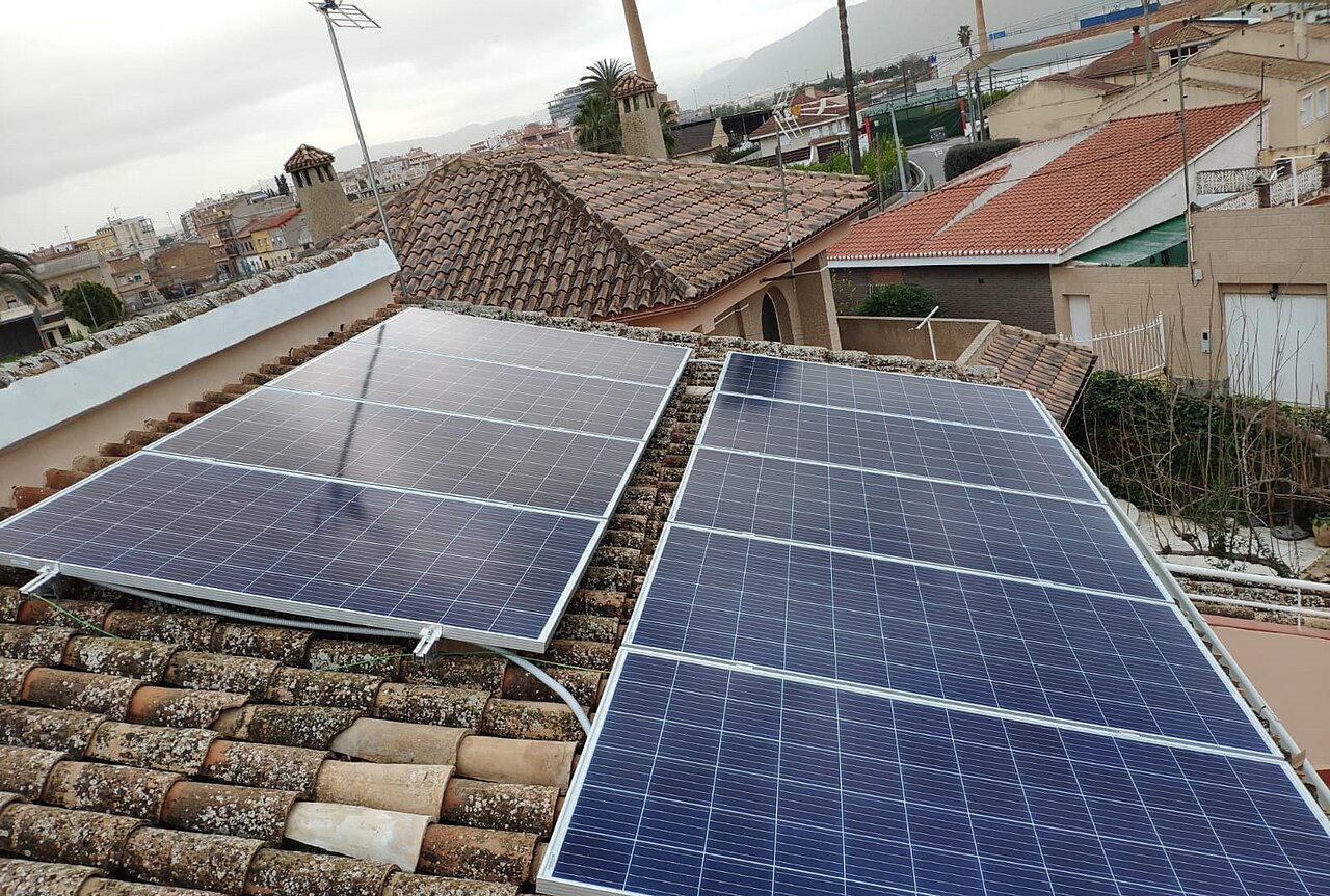 Solar panels installed on a tiled residential rooftop